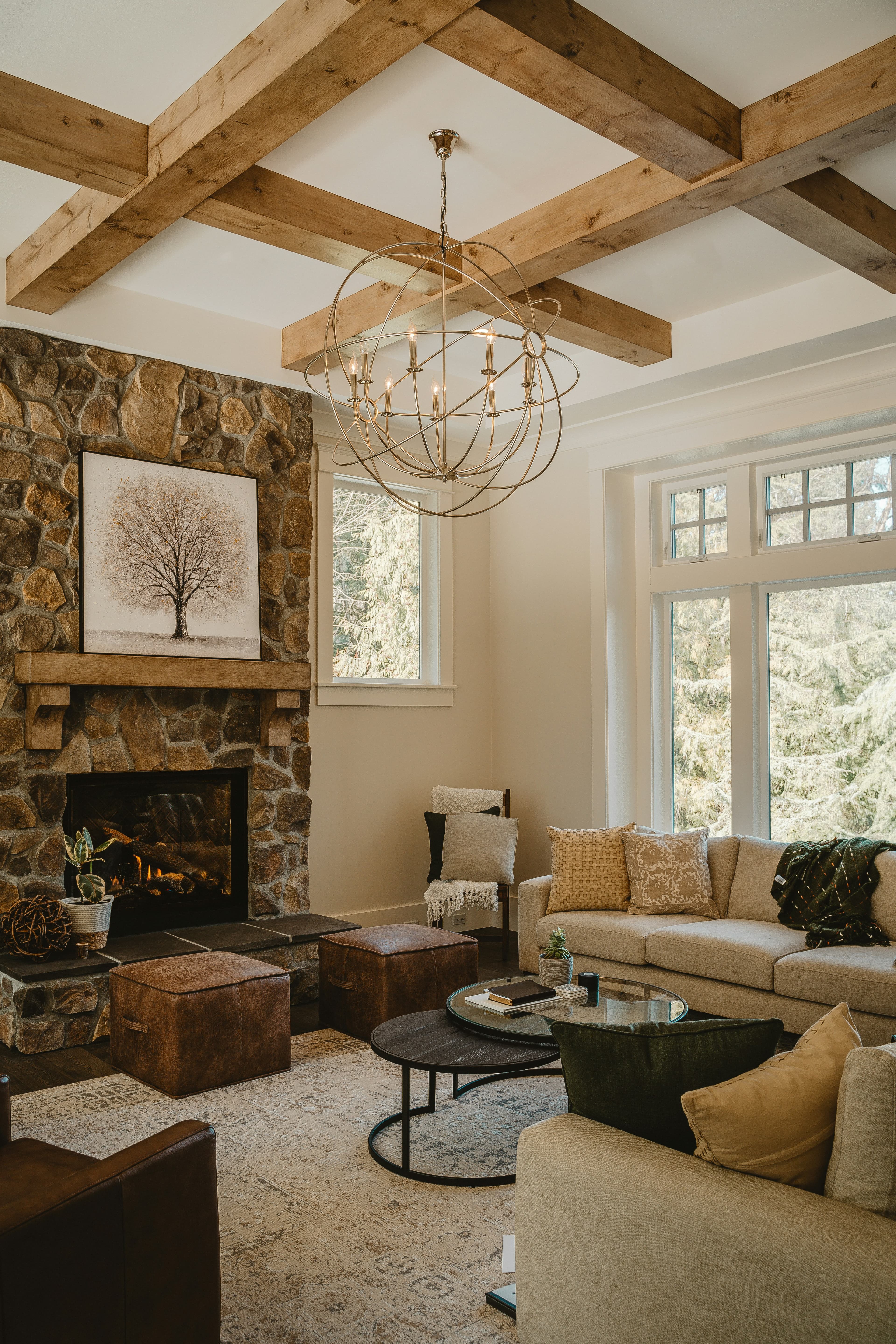Elegant stone fireplace with wood mantel and exposed ceiling beams