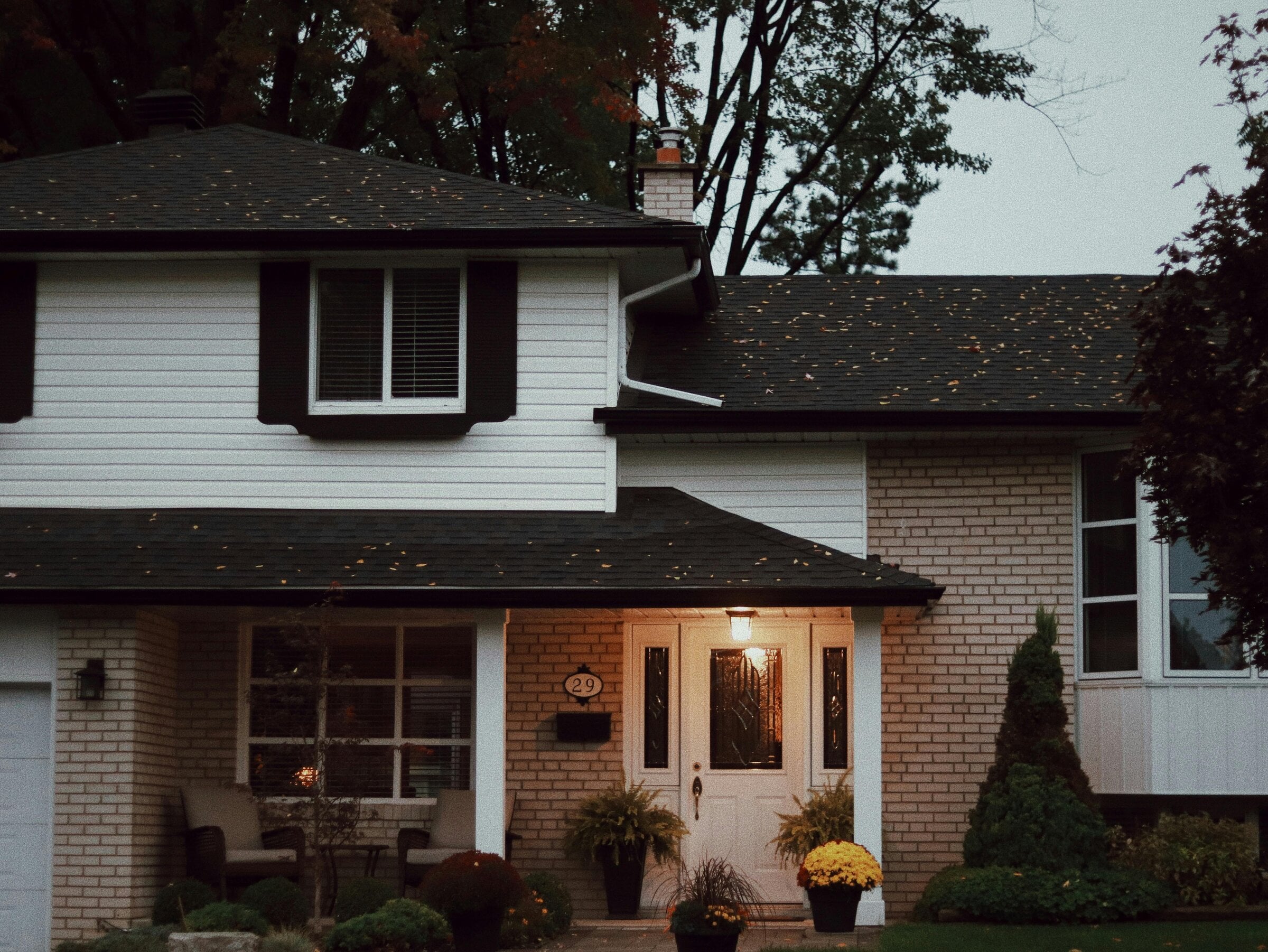 Professional chimney service on residential rooftop